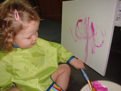 Her first experience painting with brushes!